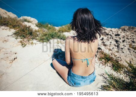 Back View Of Young Woman Enjoying Beautiful Sea