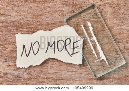Paper message, narcotics, wooden background. Drugs not save from pain.