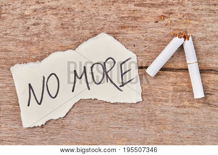Broken cigarette, message no more. No more cigarette smoking concept.
