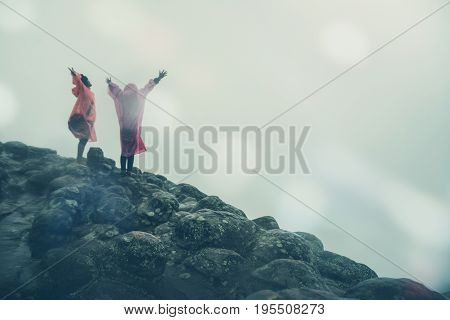 Lover Men and women Asia travel relax. walk in the forest rainy season. puhinrongkla Thailand