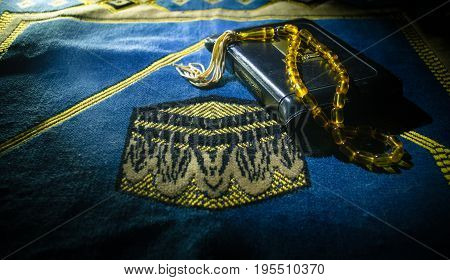 Holy Quran With Beads On A Prayer Mat, Muslim Tasbih Is A String Of Prayer Beads Which Is Traditiona