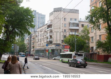 MOSCOW - JULY 13: Lower Presnya residential building people and cars on Shmitovski street on July 13 2017 in Moscow. Shmitovski Street is located in Central Administrative District of Moscow.