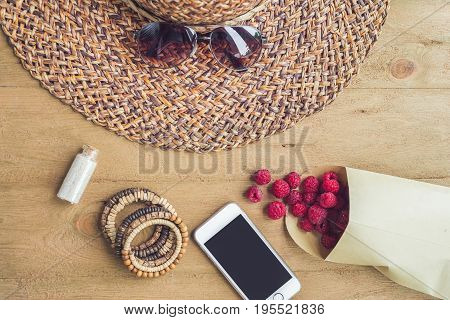 Summer Holiday, Vacation, Relaxation Concept. Raspberries, Straw Hat, Smartphone, Sunglasses From Ab