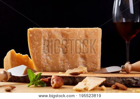 Dutch goat cheese zwart on a wooden board. Cheese and red wine