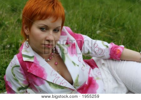 Thoughtfulness Red Girl On A Grass