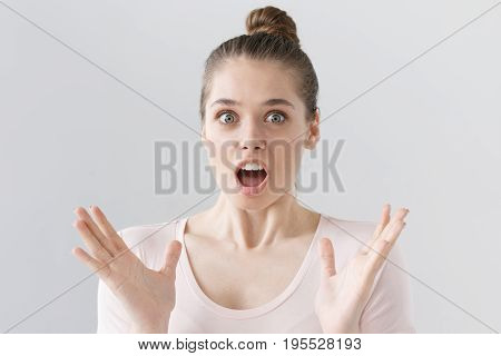Portrait Of Emotional Teenage Girl Isolated On Grey Background Looking With Eyes Round With Surprise