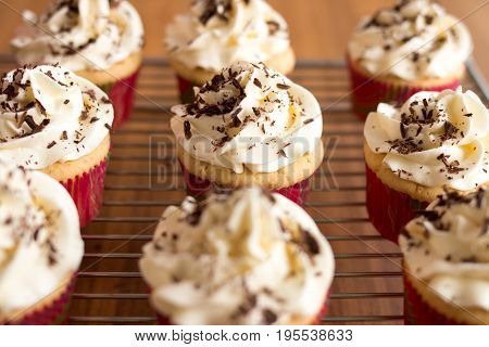 Baker Decorates Muffins With Cream And Confectionery Nozzles