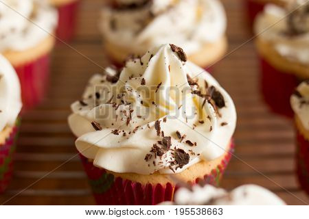 Baker Decorates Muffins With Cream And Confectionery Nozzles
