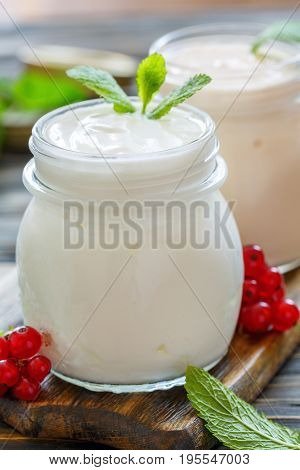 Homemade Yoghurt In A Glass Jar Closeup.