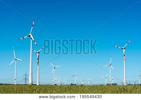 Wind power plant with many windmills seen in Germany