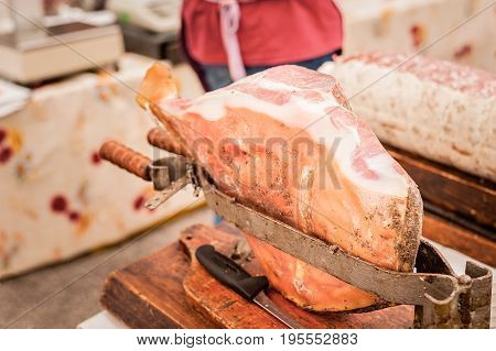 Raw ham in the vise ready to be sliced. Typical Italian raw ham.