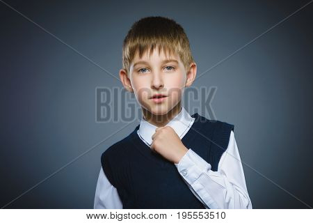 Closeup Portrait of boy going surprise isolated on gray background.