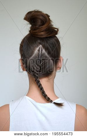 Hairstyle with long hair - young girl on a green background
