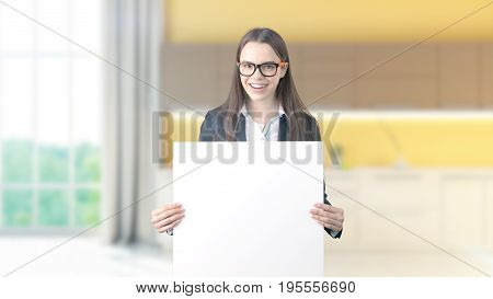 Young Beautiful Business Woman And Creative Designer Standing Over Blured Interior Background