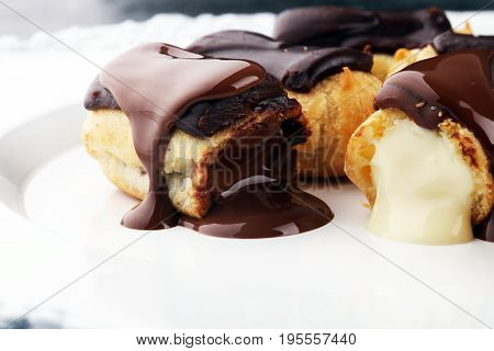 Traditional French Dessert. Eclair With Chocolate Icing. Pastery Concept