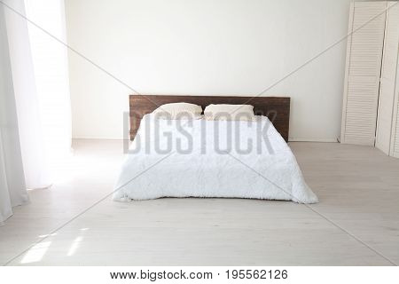 Interior white bedroom this morning with bed 1
