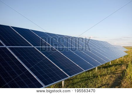 Solar cell panels in the field. Photovoltaic panels installed with helical piles.