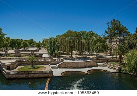 Panoramic of the 18th-century Gardens of the Fountain, built around the Roman thermae ruins, in the city center of Nimes. Located in the Gard department, Occitanie region in southern France