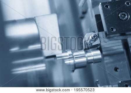 CNC lathe machine (Turning machine) cutting the metal screw thread part .Hi-precision CNC machining concept.