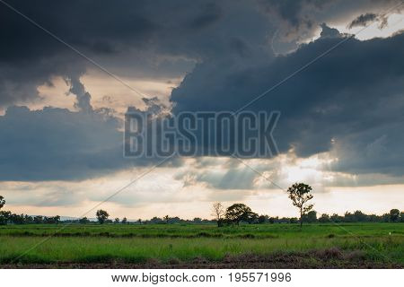 Storm formed Along with the sun through the clouds.dark tone