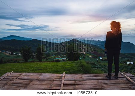 Asian women travel sleep relax. Morning atmosphere nature Forests mountains. Phu Thap Buek Thailand