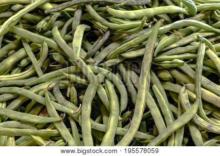 A background image of fresh green beans