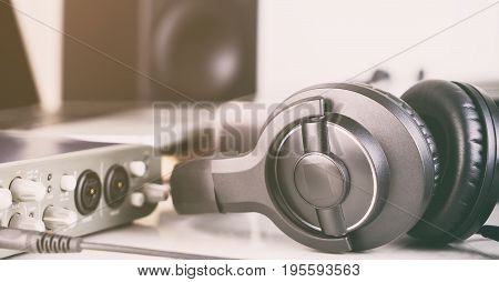 Black studio headphone in home music studio