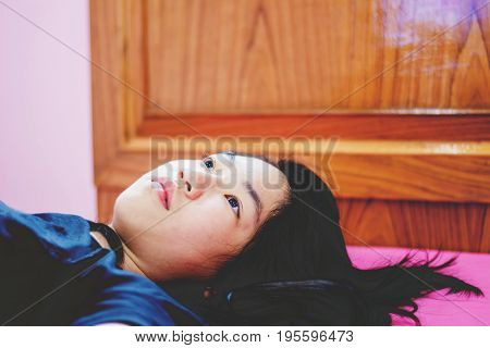Girl Lay On Bed With Absent Minded