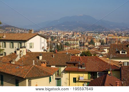 Good area with yellow ochra building, roof tiles roof against sea viewpoint. Europe