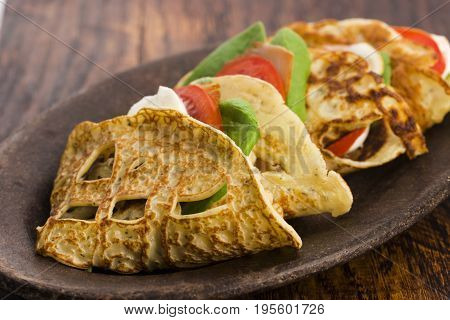 Pancakes Sutffed With Ham, Cheese, Tomatoes And Spinach