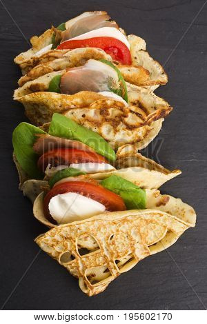 Pancakes Sutffed With Ham, Cheese, Tomatoes And Spinach