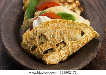 Pancakes Sutffed With Ham, Cheese, Tomatoes And Spinach