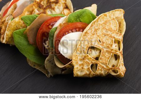 Pancakes Sutffed With Ham, Cheese, Tomatoes And Spinach