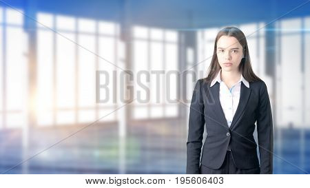 Young Beautiful Business Woman And Creative Designer Standing Over Blured Interior Background