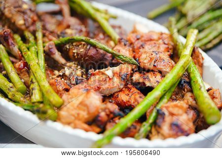 Fried Green Asparagus With Chicken Thighs, Dining Concept Of Nutrition. Buffet. Food.