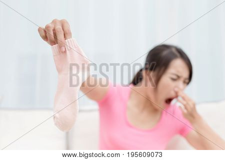 woman with smelly socks in the room