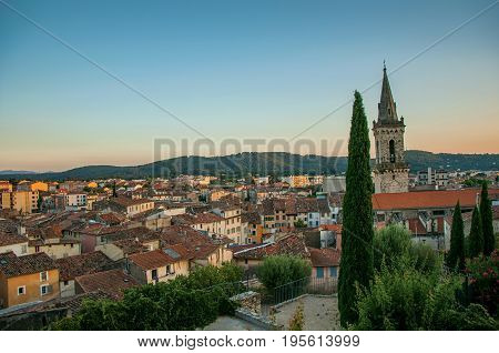 View of the graceful town of Draguignan from the hill of the clock tower under the colorful light of the sunset. Located in the Provence region, Var department, southeastern France