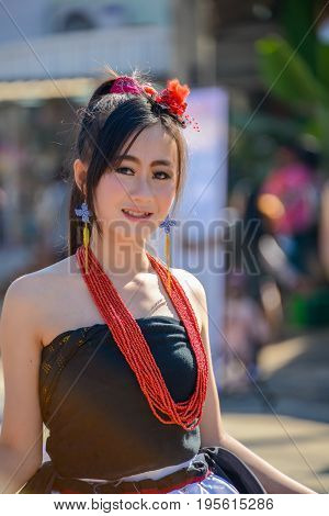CHIANGMAI THAILAND - JANUARY 25 2015: Indigenous girl with local traditional costume in parade of 22nd Traditional Skirt Fabric and The Indigenous Product and Culture Festival in Mae Chaem Chiangmai Thailand