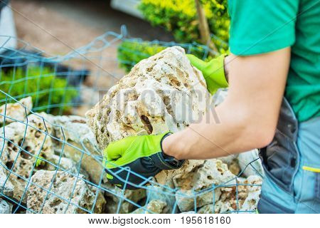 Choosing Rockery Garden Elements. Decorative Stones. Landscaping and Gardening Theme.