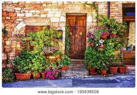 Charming floral decorated streets of medieval towns of Italy. Spello in Umbria