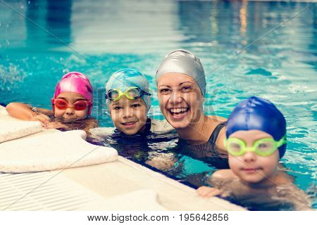 Group Swimming Lesson For Children On Indoor Swimming Pool, Toned Image