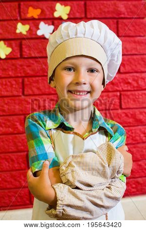 Alchevsk, Ukraine - July 16, 2017: Children's Master Class On Cooking Potatoes In The Oven With Ham 