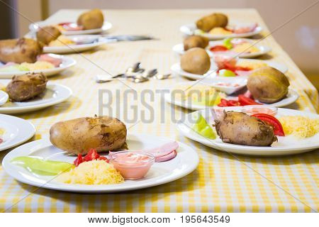 Alchevsk, Ukraine - July 16, 2017: Children's Master Class On Cooking Potatoes In The Oven With Ham 