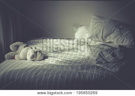 Abandon Dog Doll Toy On The Bed In The Morning With Dark Vintage Tone Sadness Loneliness Broken Hear