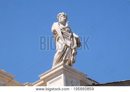 ROME, ITALY - SEPTEMBER 02: St Leonard, fragment of colonnade of St. Peters Basilican - the world largest church, is the center of Christianity in Rome, Italy on September 02, 2016.