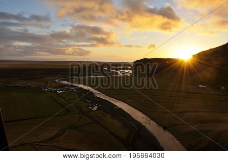 Sunset near a river on a beautiful day in iceland
