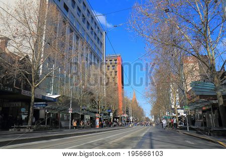 MELBOURNE AUSTRALIA - JULY 7, 2017: Unidentified people visit Swanston street in downtown Melbourne.