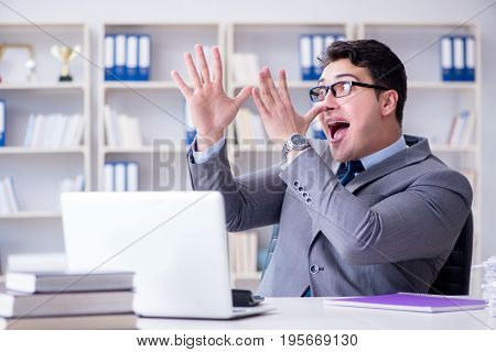 Funny businessman clown acting silly in the office