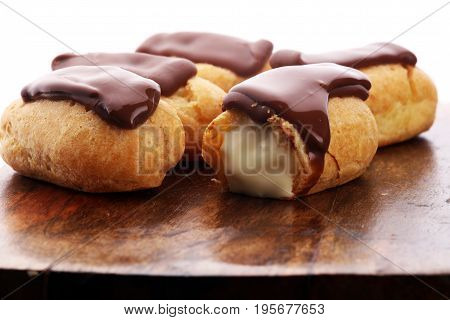 Traditional French Dessert. Eclair With Chocolate Icing. Pastery Concept