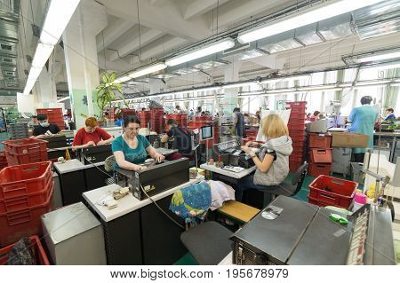 Shoe Factory. Female Worker On A Sewing Machine.
